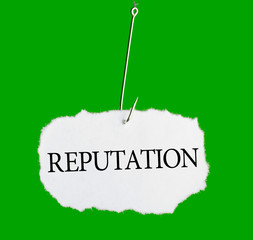 Word REPUTATION on a fishing hook on green background