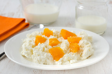 cottage cheese with orange on the plate