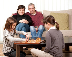 family playing chess