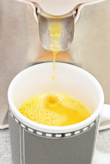 Extracting orange juice with hand
