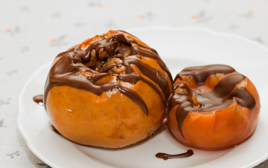 Baked apple and canned peach covered with chocolate