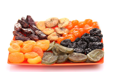 delicious dried fruits on plate isolated on white
