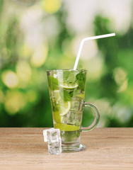 Glass of cocktail with lime and mint