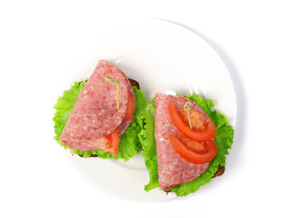 sandwich with sausage on a plate up