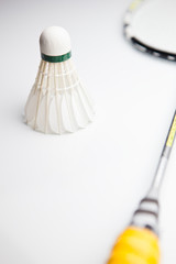 badminton shuttlecock and racket on white background