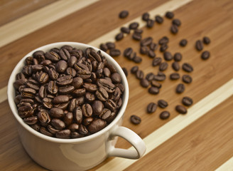 White Cup Filled with Coffee Beans