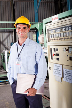 male industrial technician inside a factory