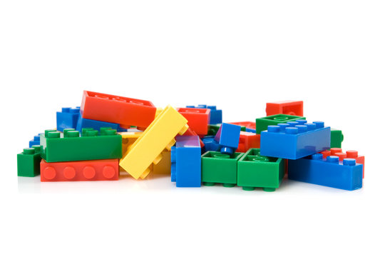 colorful plastic blocks over white background