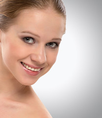 Fototapeta premium beautiful face a healthy young woman smiling