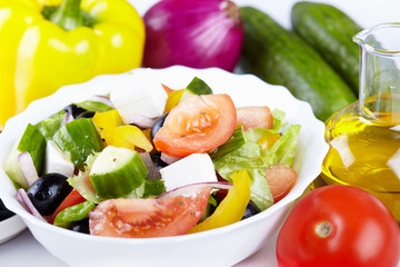 Greek salad and ingredients to it