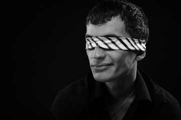 A man smiling with his eyes closed