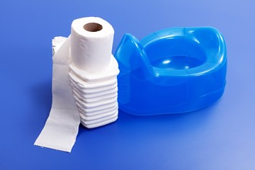 Toilet paper, diapers and blue potty