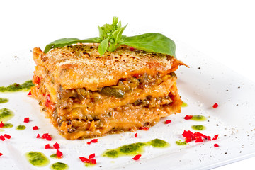 Closeup of lasagna and basil fork