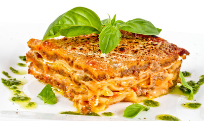 Closeup of lasagna and basil fork