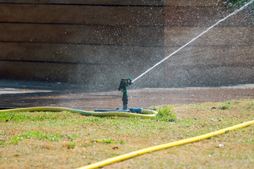Irrigation sprinkler watering grass