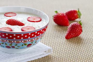Breakfast porridge with strawberries