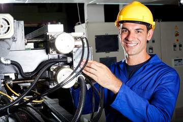 happy industrial machine operator at work