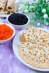 Pancakes with red and black caviar