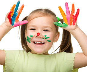 Cute cheerful girl with painted hands