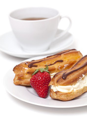 fresh cream puff with whipped cream and strawberry