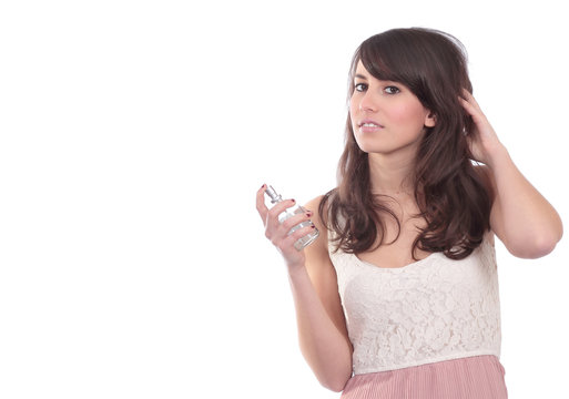 Attractive girl with fragrance bottle