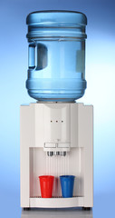 Electric water cooler on blue background