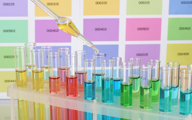Test-tubes with color liquid and pipette