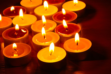 Beautiful candles and decor on wooden table