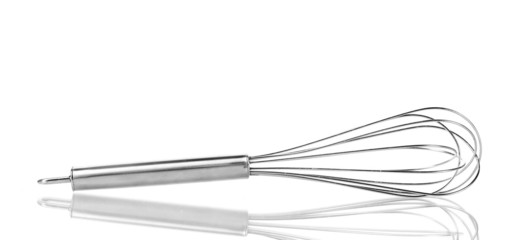 Metal whisk for whipping eggs isolated on white