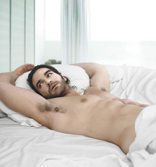 Fototapeta na wymiar Man in bed