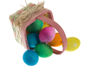 Square Easter basket spilling dyed eggs