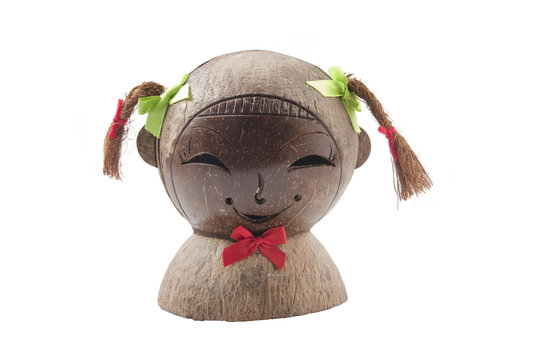 Sculpture of the smiling girls head made of coconut shell.