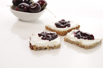 Whole grain bread with quark and cherry jam