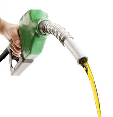 Male hand wasting gas with green pump isolated on white