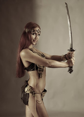 woman holding sword in her hand