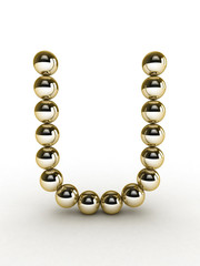 3d alphabet of gold beads.