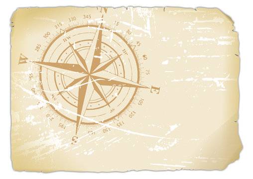 vergilbtes Blatt Papier mit aufgedrucktem Kompass