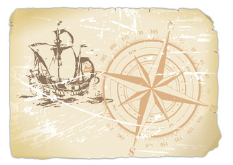 vergilbtes Papier mit Kompass und Segelschiff