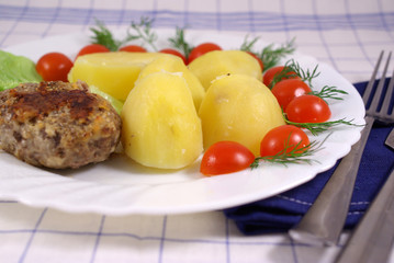 Boiled potatoes wish cutlet