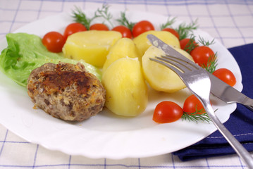 Boiled potatoes wish cutlet