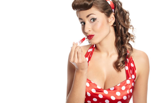 Pin-up  woman applying her make-up