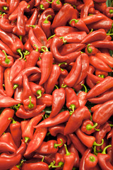 Pile of red peppers forming a background