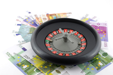 Roulette with money over white