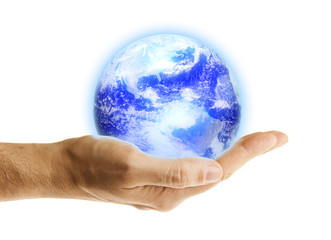 Glowing blue earth in a hand on white background
