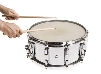 Male hand playing big metal snare drum isolated on white