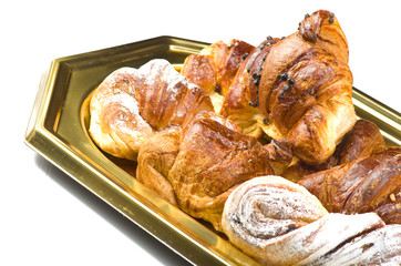 Fresh and tasty croissant on the white