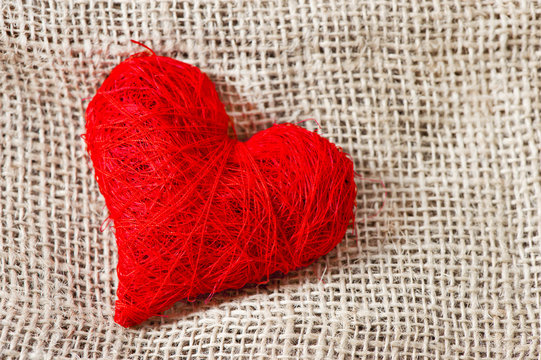 red heart on burlap background