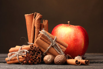 Cinnamon sticks,red apple, nutmeg,and anise