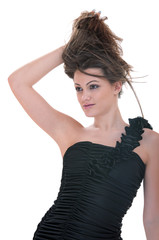 The woman in black dress corrects the hair by hand