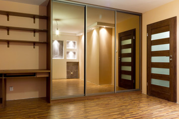 Modern apartment interior with huge wardrobe